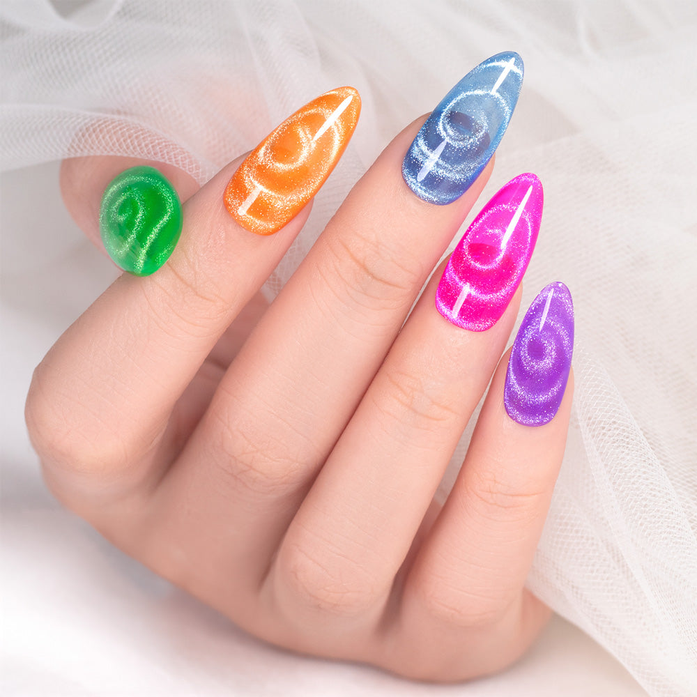 Double-ended magnet pen creating cat eye effect on green gel polish circular crescent pattern professional nail art