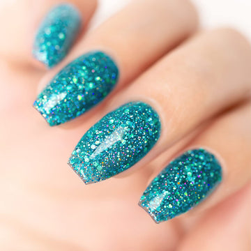 Ocean Sparkle turquoise glitter manicure with pink yellow green holographic iridescent sparkles
