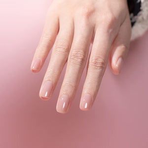 Petal Veil rose nude manicure short nails natural sheer pink finish on hand
