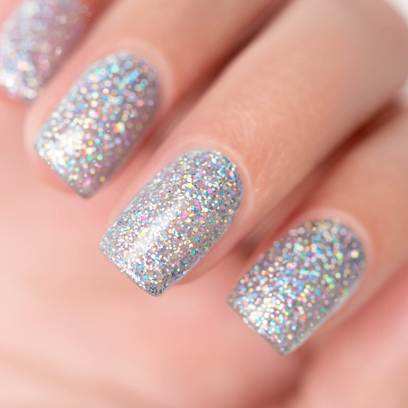 Cosmic silver holographic glitter manicure with ultra-dense rainbow iridescent sparkles on nails close-up
