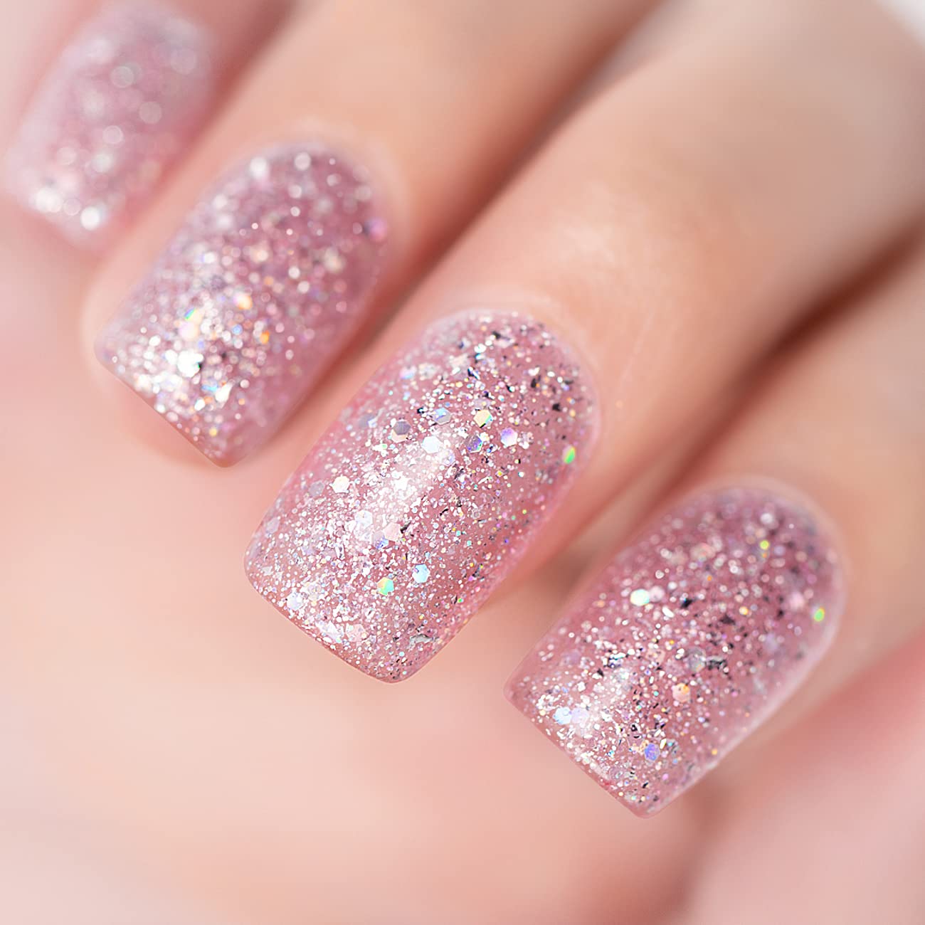 Stardust Blush pink mauve glitter manicure with iridescent holographic rose gold silver sparkles on nails
