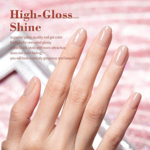 Gray pink rainbow shimmer manicure high-gloss shine natural nude sparkle on hand with iridescent glitter
