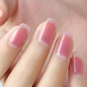Sheer pink jelly manicure long coffin nails natural healthy glow translucent finish on hand
